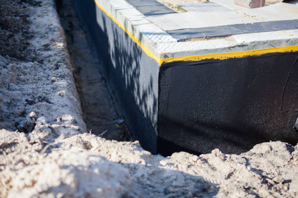 Professional Basement Waterproofing technician working in Butler, KY